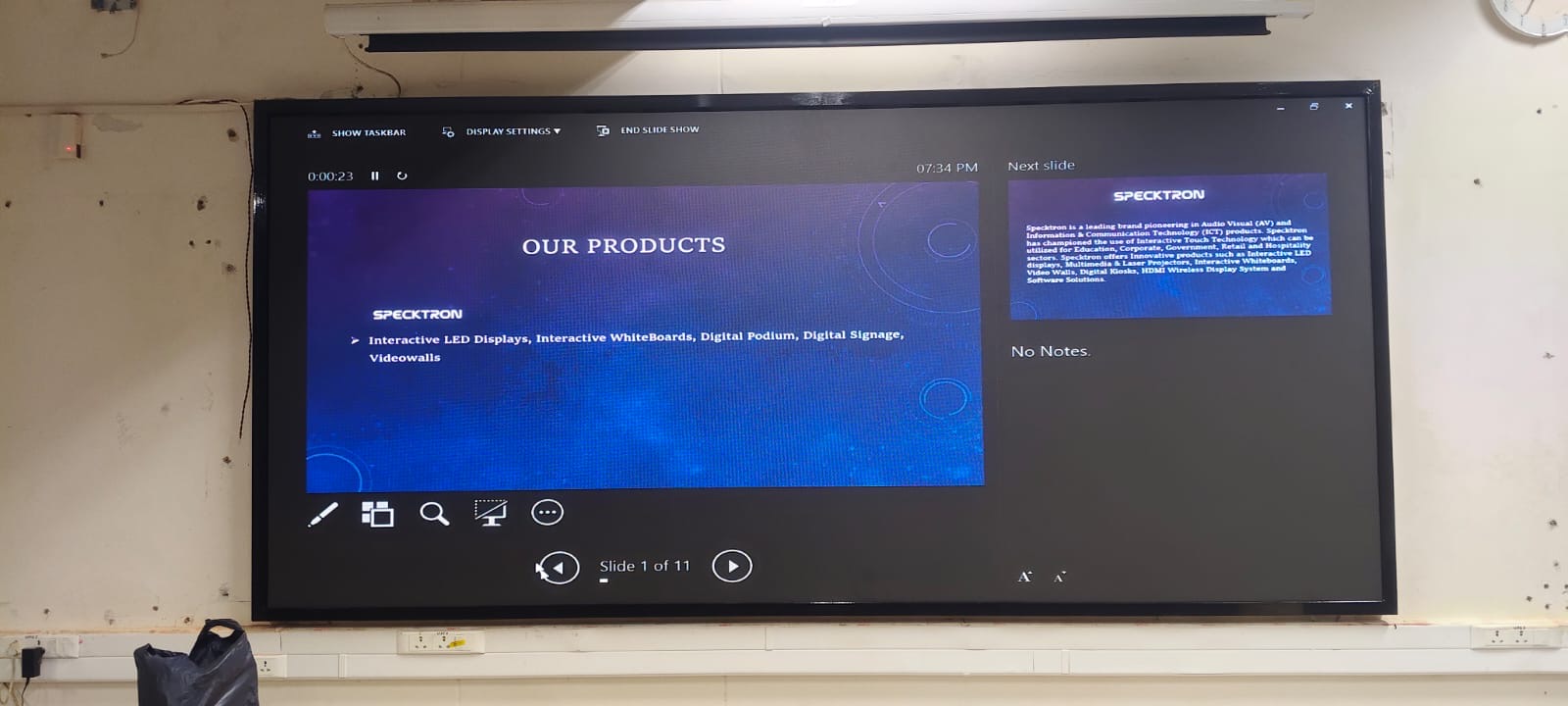 Presentation on a large display screen in a school auditorium