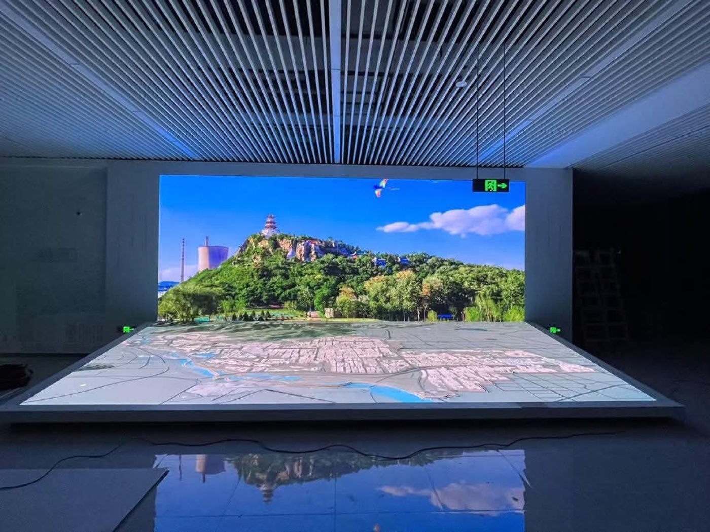 Interactive LED floor display with 3D city model and LED backdrop wall